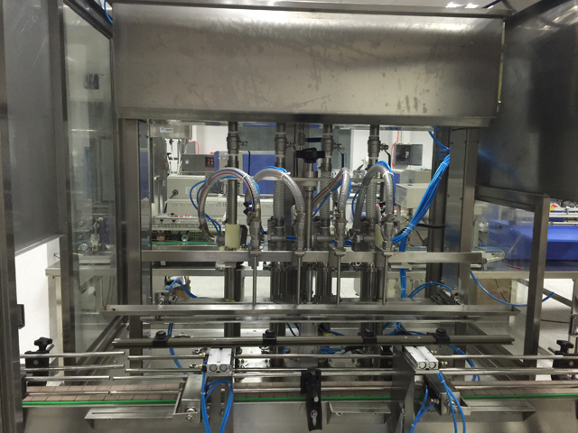 μηχανήματα πλήρωσης τεσσάρων κεφαλών.jpg