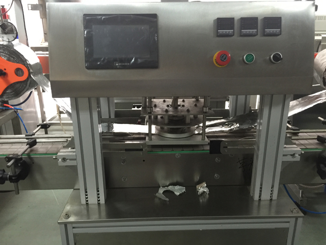 μηχανή σφράγισης βάζων.jpg