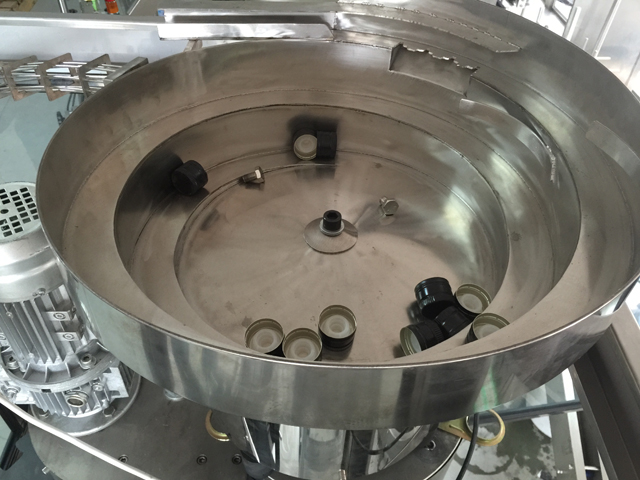 καπάκια σύστημα τροφοδοσίας δονητή.jpg